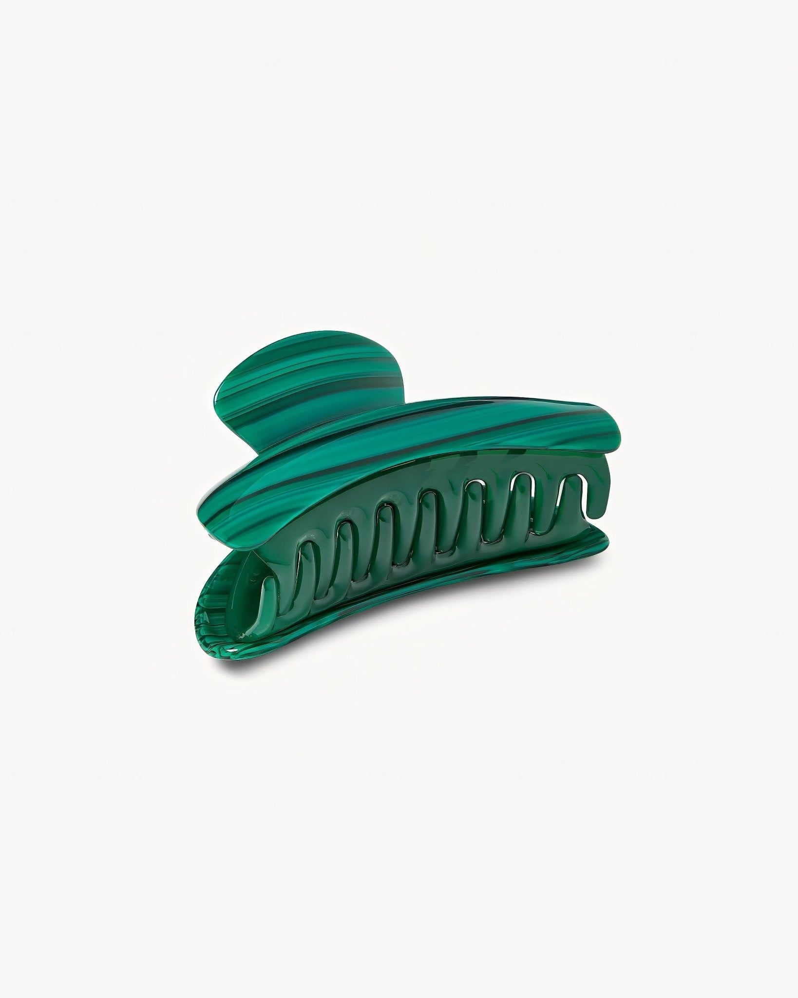 Green hair clip on a white background