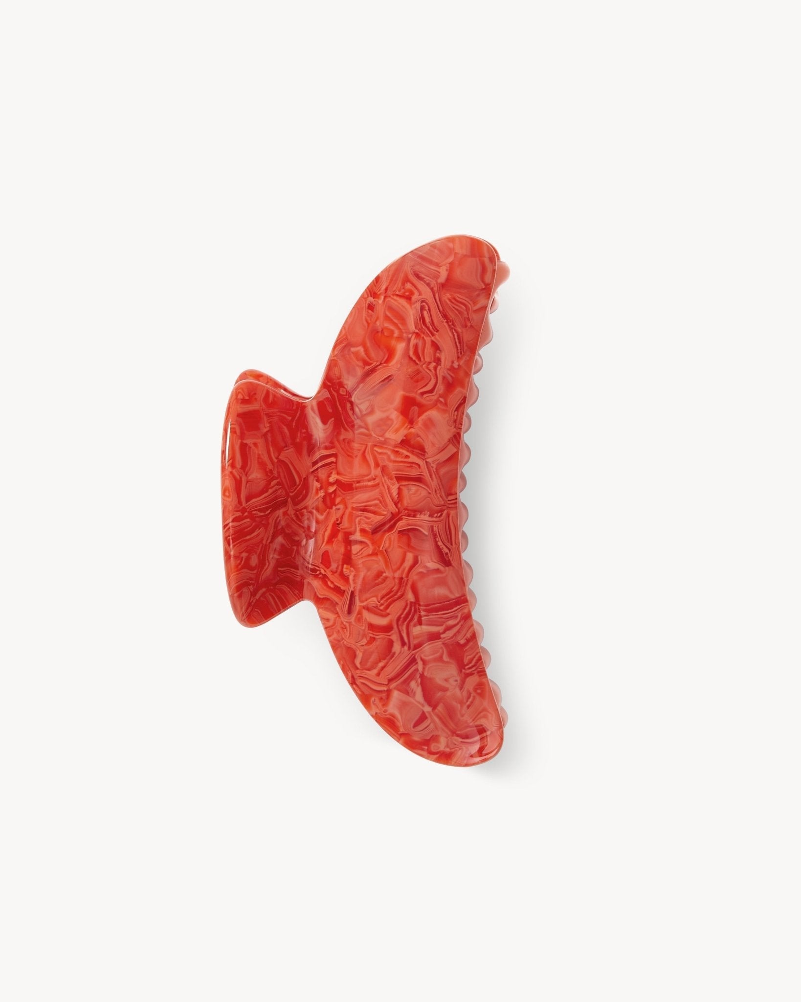 Red textured object on a white background 