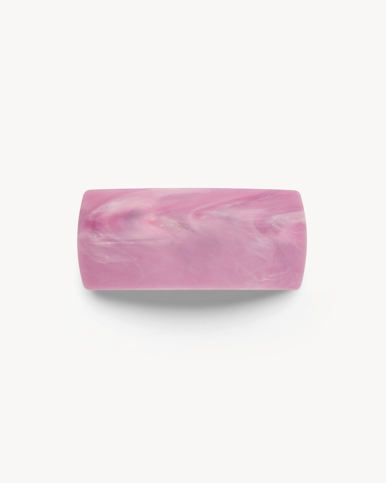 Pink marbled hair clip on a white background 