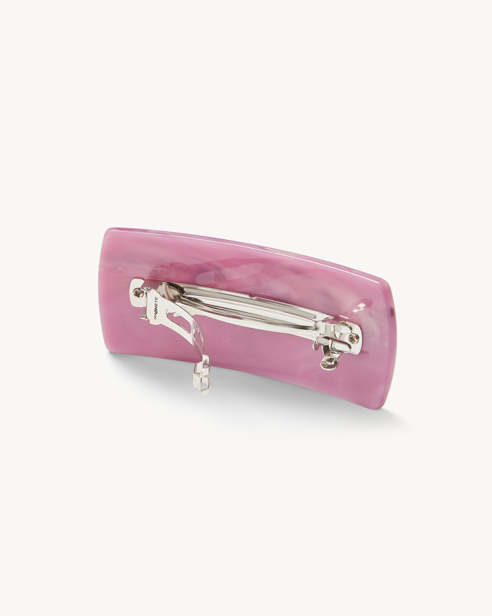 Pink hair clip with a clear barrette on a white background