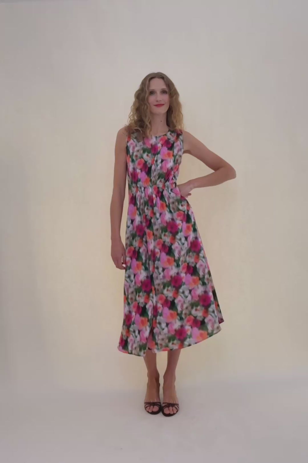 woman in floral print dress.