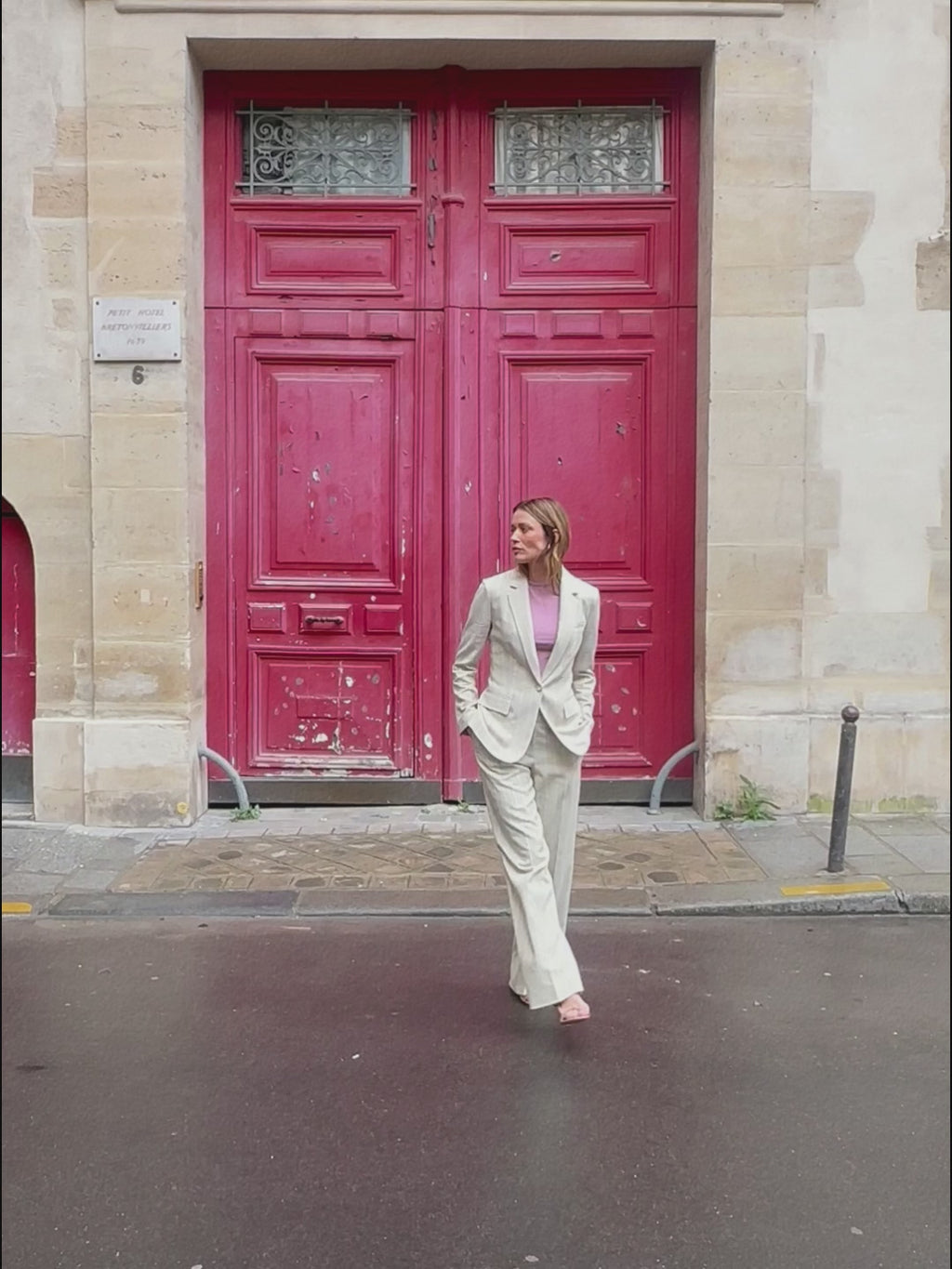 woman in linen stripe blazer with matching pants .