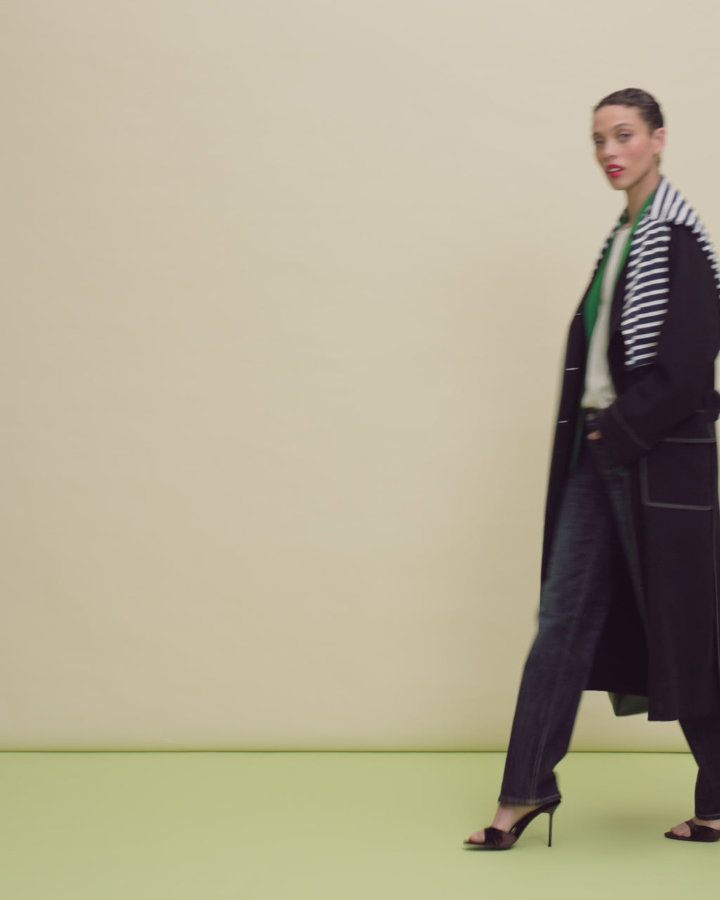 woman in black coat and jeans.