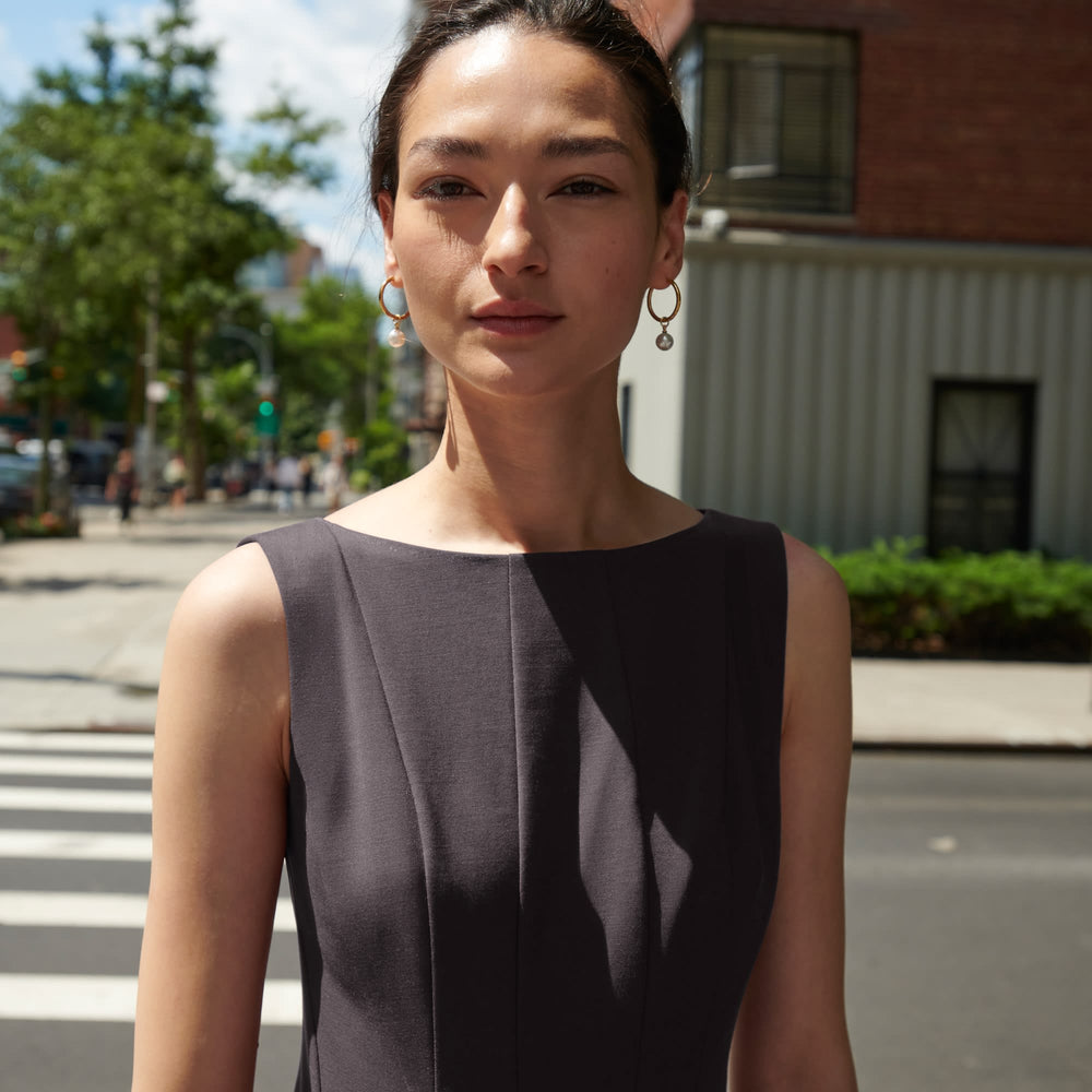 Front image of a woman standing wearing the Gabriella Dress in Haze