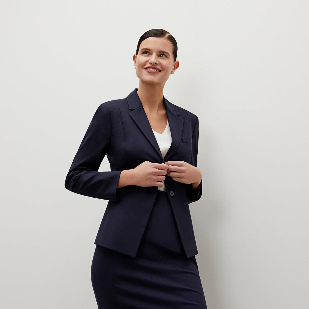 Front image of a woman standing wearing the Hoffman blazer in Galaxy Blue