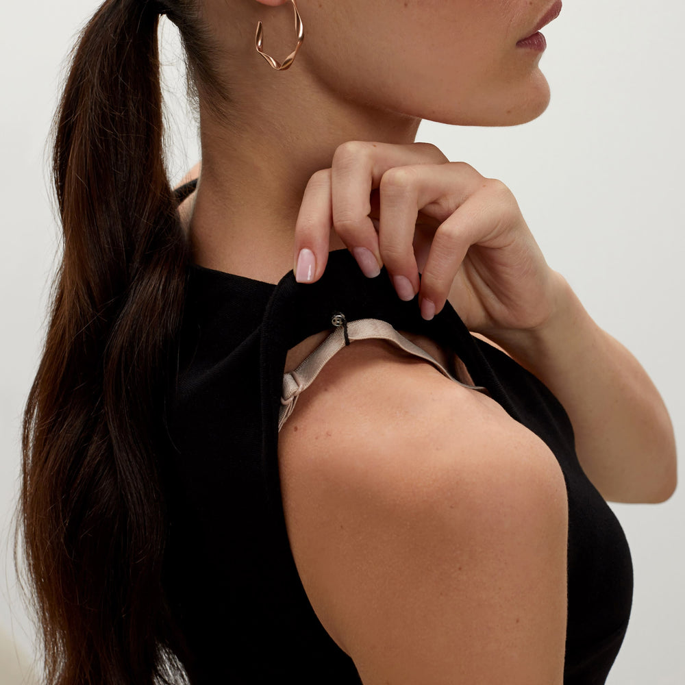 Detail image of a woman standing wearing the Rachel dress in black