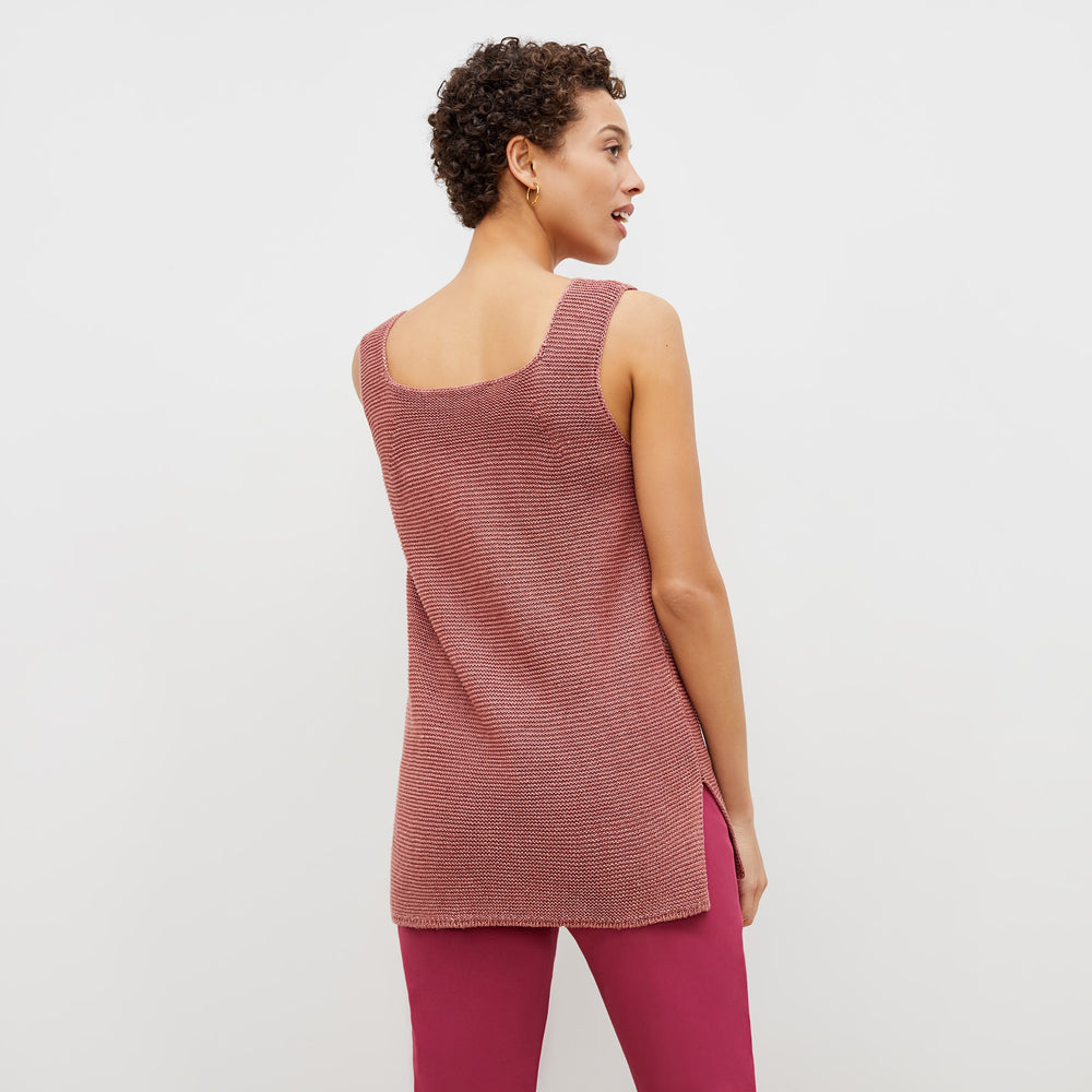 Back image of a woman standing wearing the adele tunic in copper