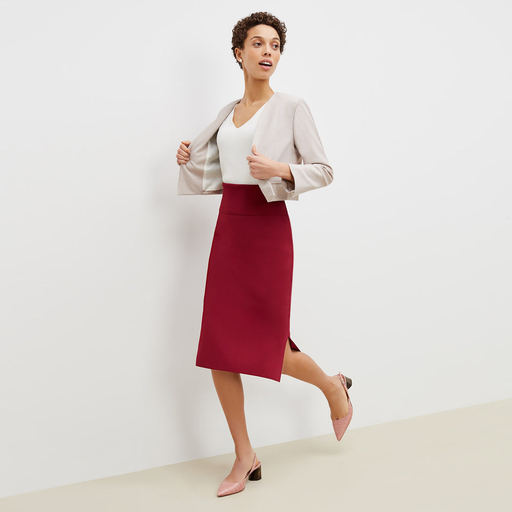 Front image of a woman standing wearing the harlem skirt in hibiscus