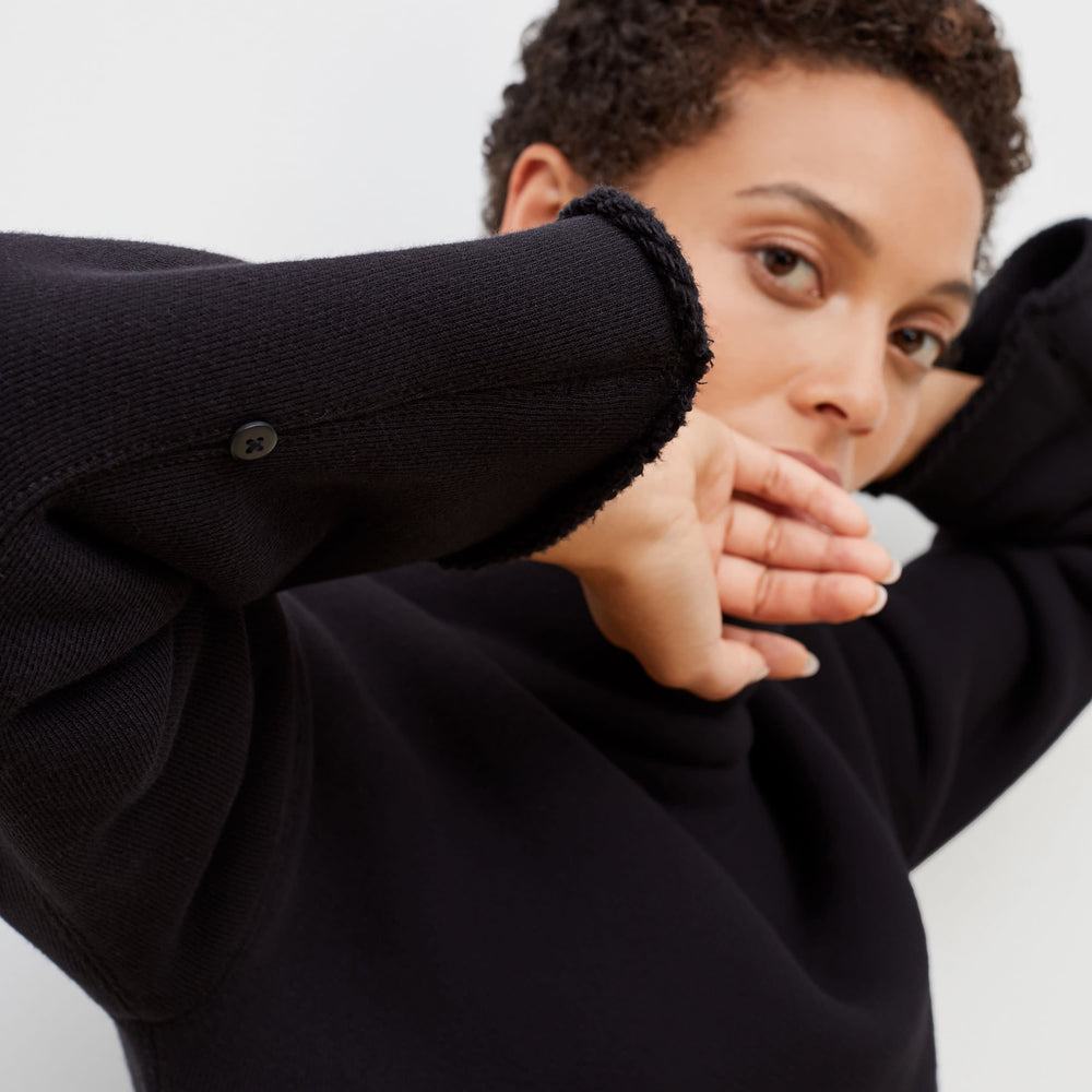 Detail image of a woman standing wearing the Sharon Top—Plush Terry in Black