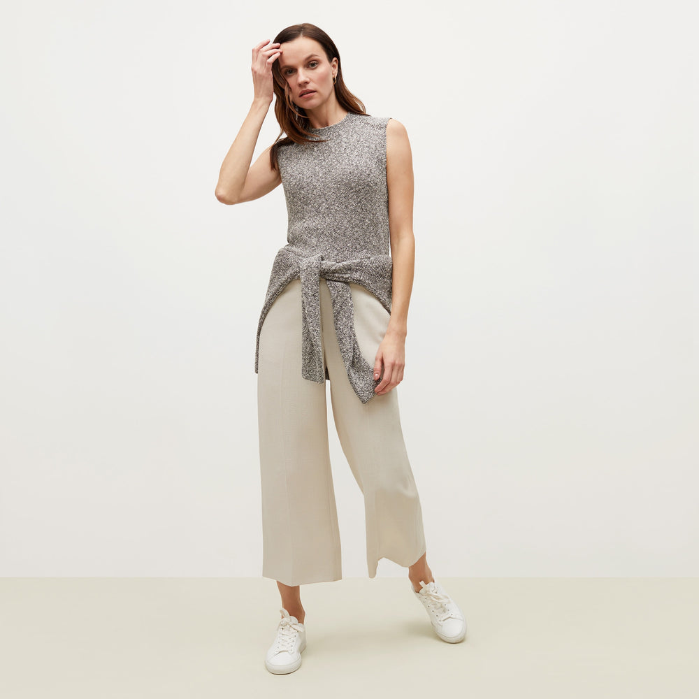 Front image of a woman standing wearing the Barbara Sweater—Knit Boucle in Black / White