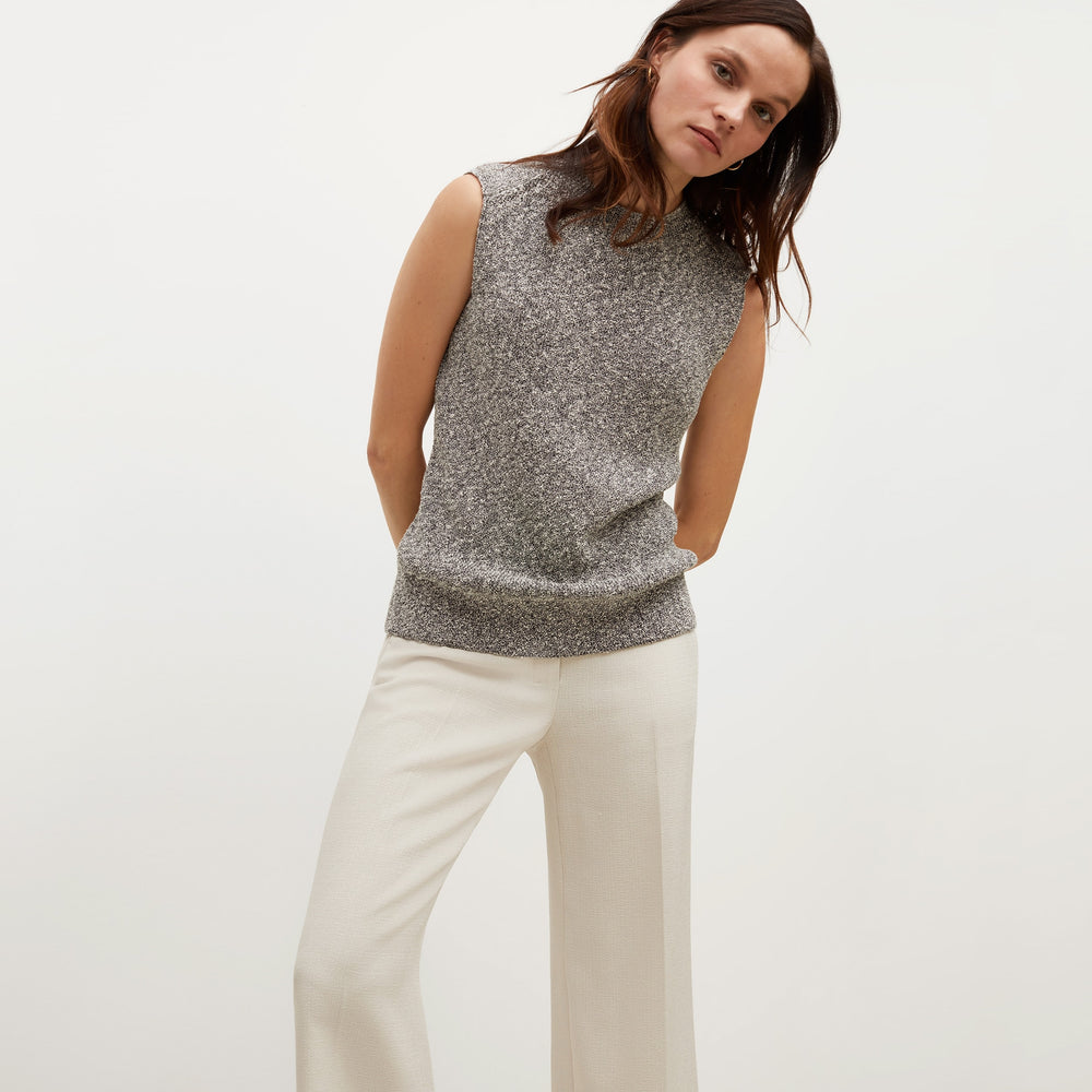 Front image of a woman standing wearing the Barbara Sweater—Knit Boucle in Black / White
