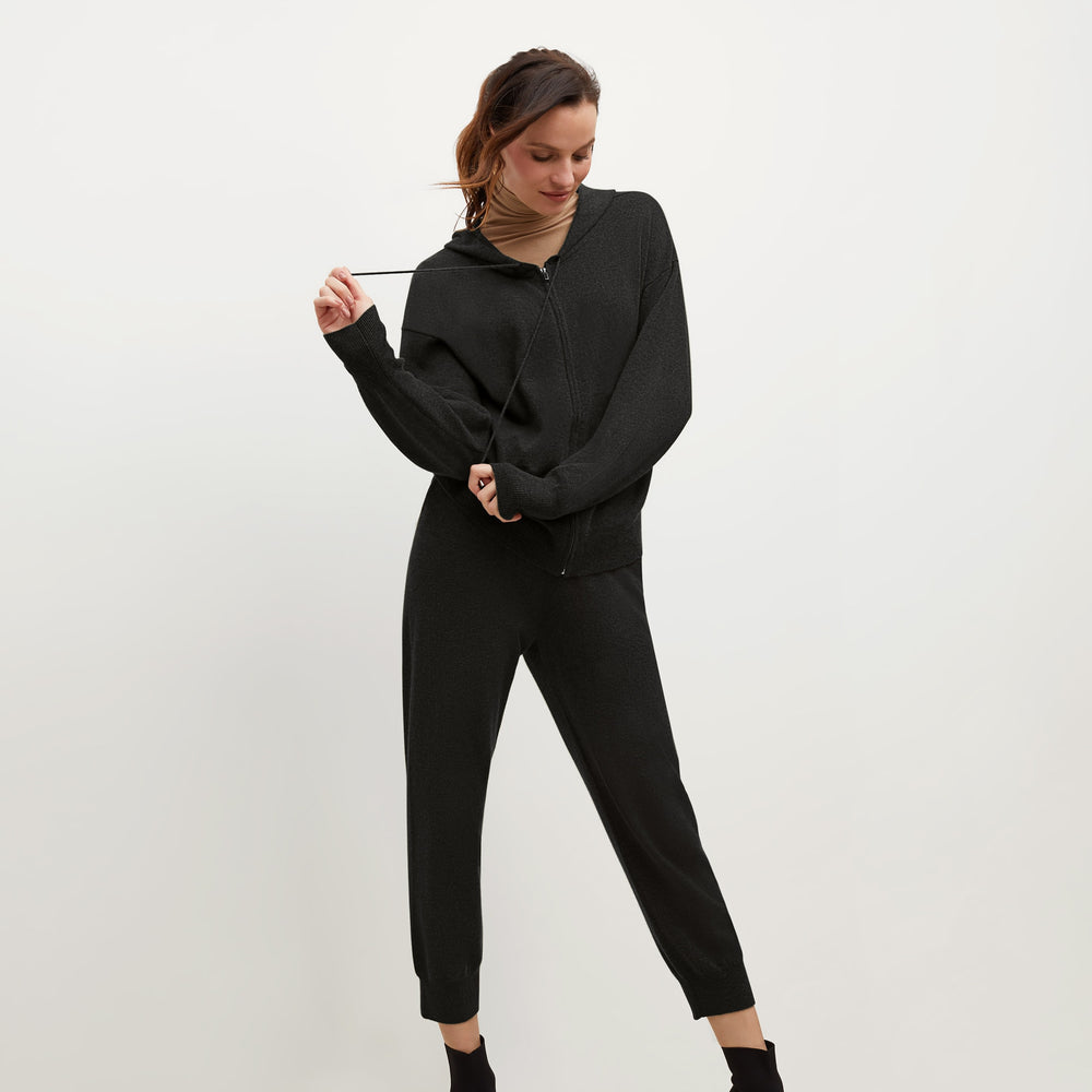 Front image of a woman standing wearing the Judith Hoodie—Cashmere in Black