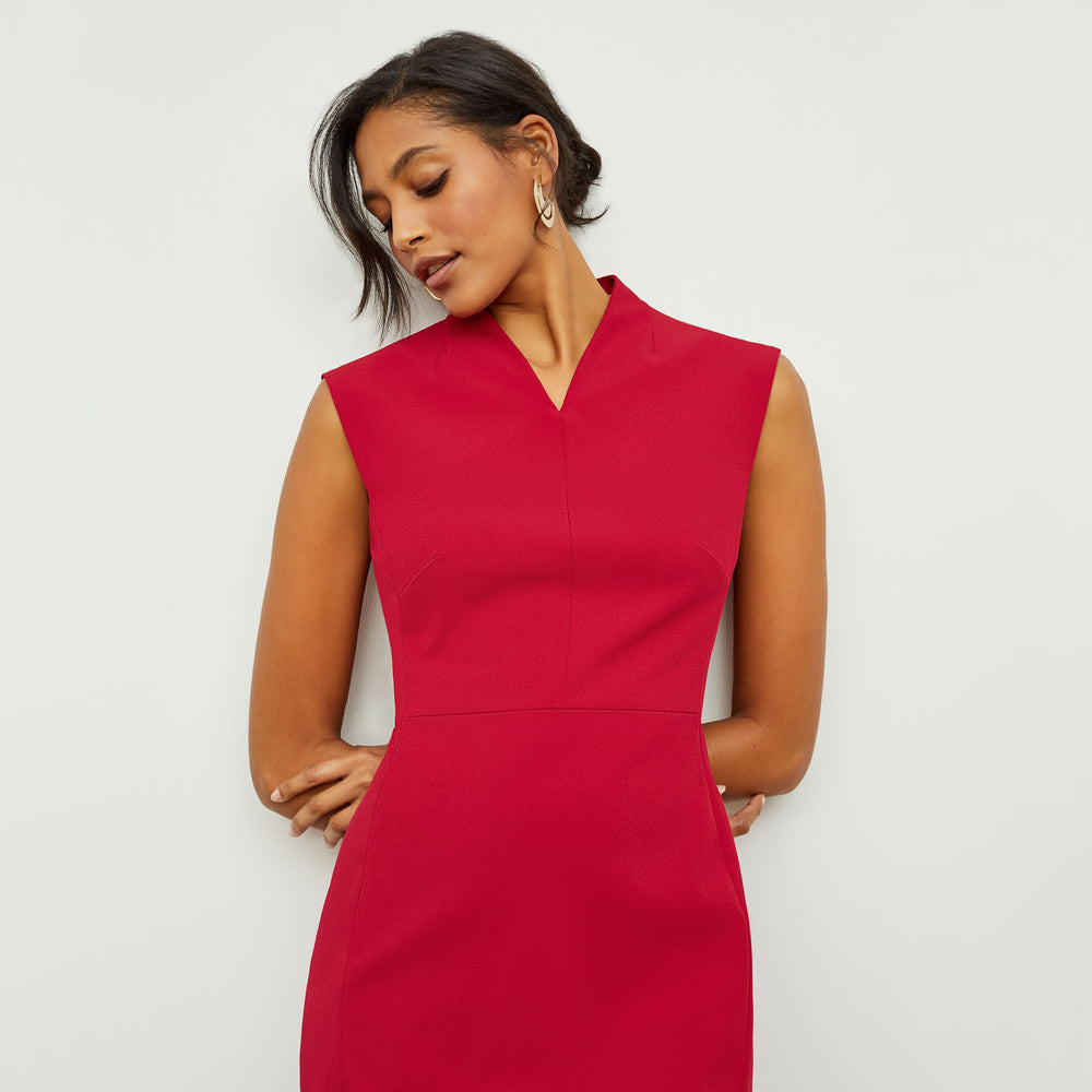 Detail image of a woman standing wearing the Aditi Dress—Recycled WonderTex in Rhubarb