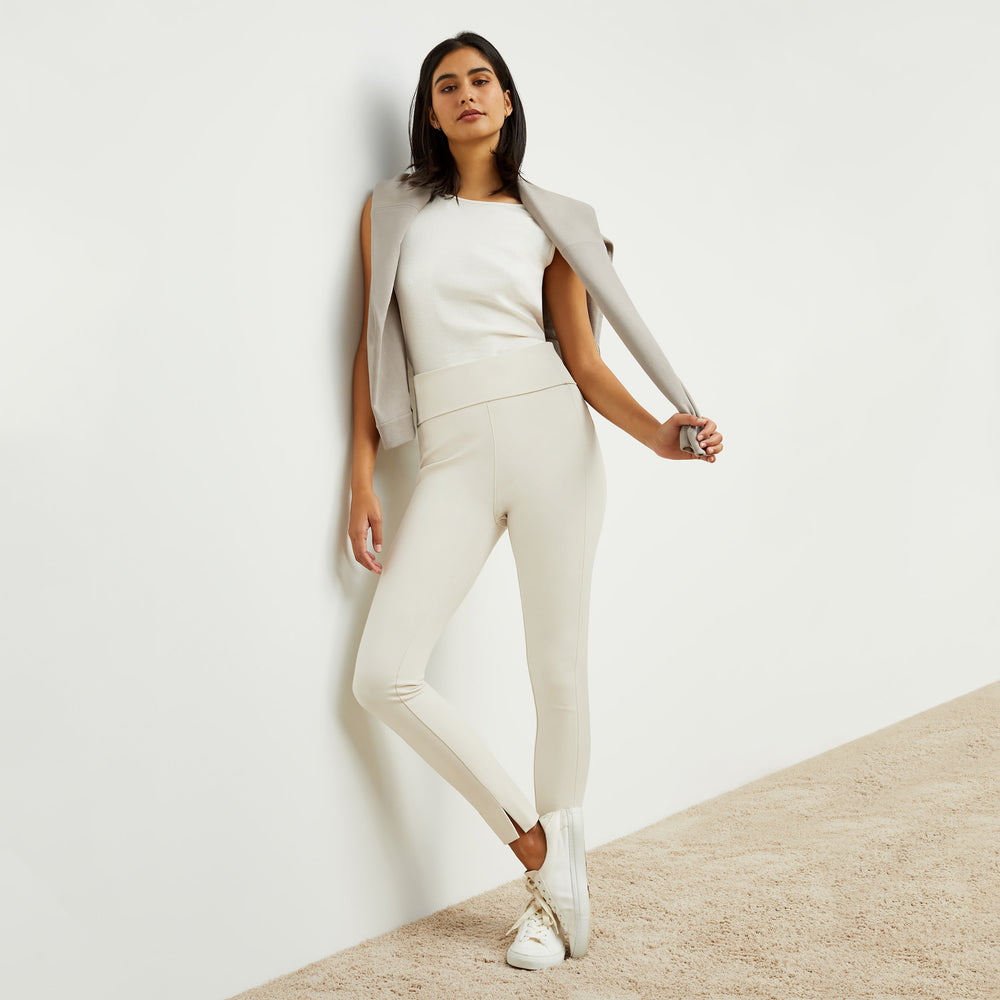 Front image of a woman standing wearing the stella legging in pearl
