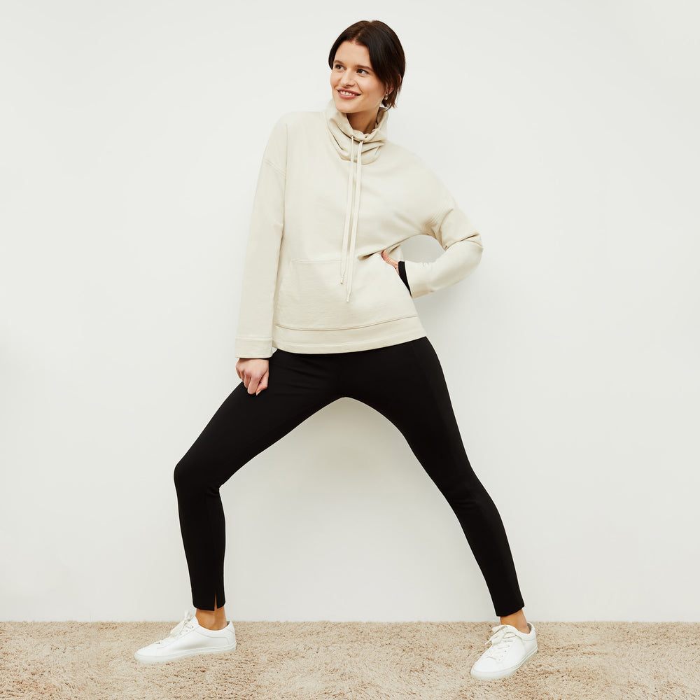 Front image of a woman standing wearing the Harris Sweatshirt—Fine Terry in Pearl