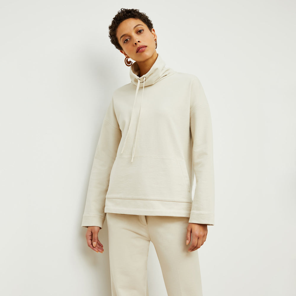 Front image of a woman standing wearing the Harris Sweatshirt—Fine Terry in Pearl