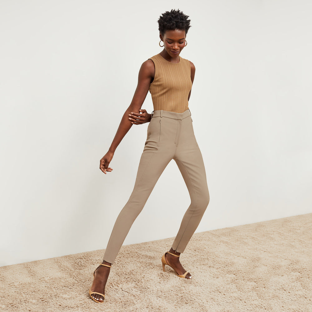 Front image of a woman standing wearing the Louisa Top in Sandstone