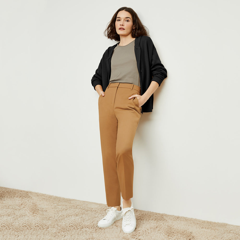 Front image of a woman standing wearing the Judith Hoodie—Cashmere in Black