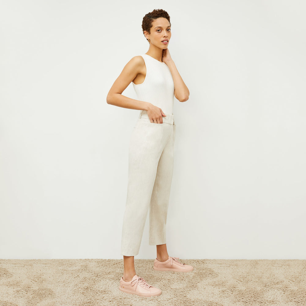 image of a woman wearing M.M.LaFleur x Koio Capri Low-Top Sneakers—Leather in white, smoke and azalea