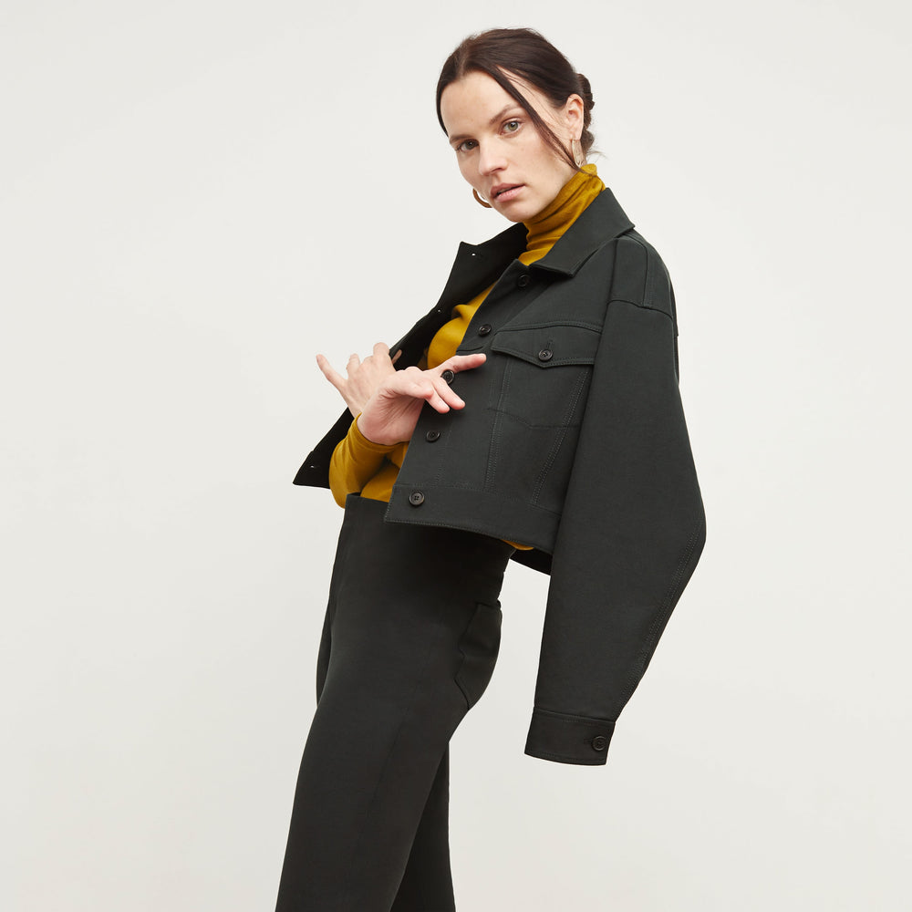 Side image of a woman standing wearing the Hockley Jean in Hemlock