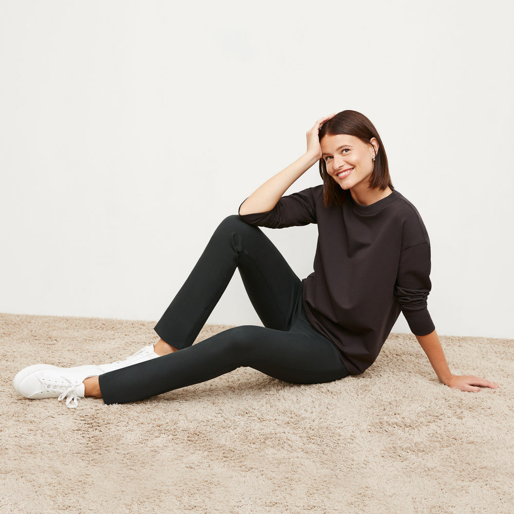 Side image of a woman standing wearing the Hockley Jean in Hemlock