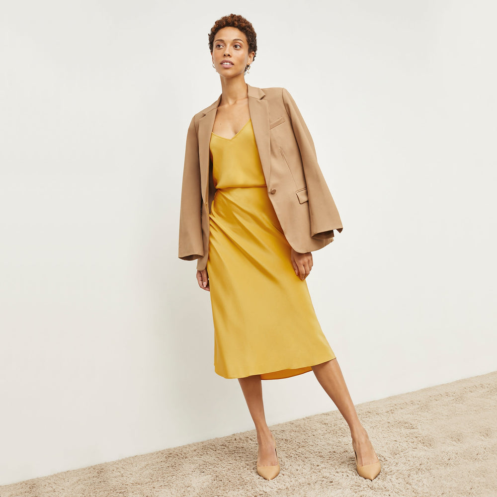 Front image of a woman standing wearing the Lisey Cami—Washable Silk in Dijon