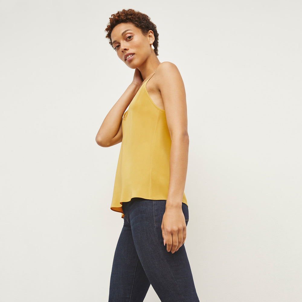 Side image of a woman standing wearing the Lisey Cami—Washable Silk in Dijon
