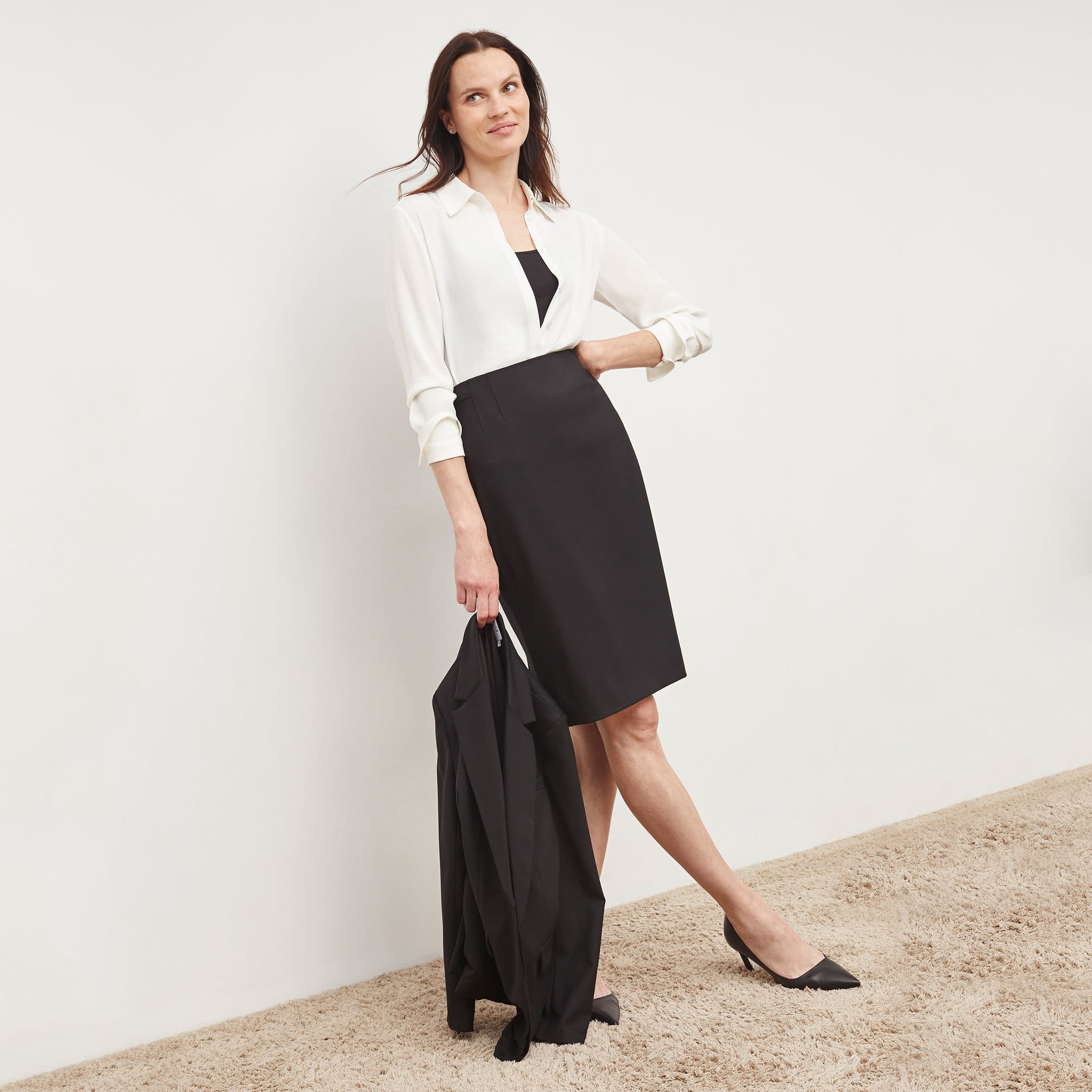 Front image of a woman wearing the tatum shirt in ivory