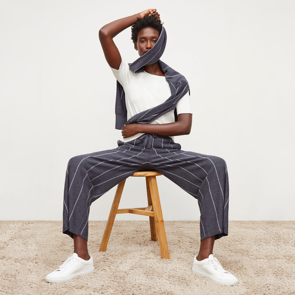 Front image of a woman standing wearing the tressa pant in braided stripe in charcoal and ivory