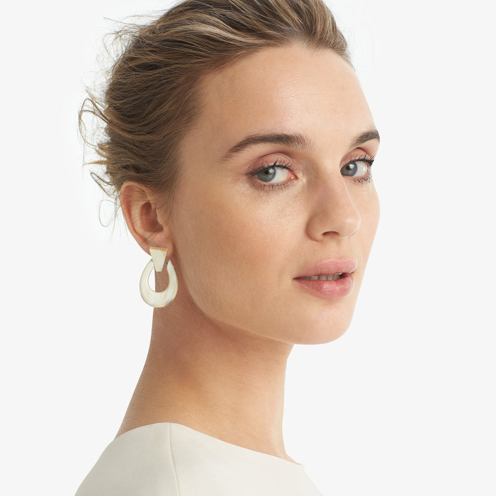 image of a woman wearing the wanda earrings