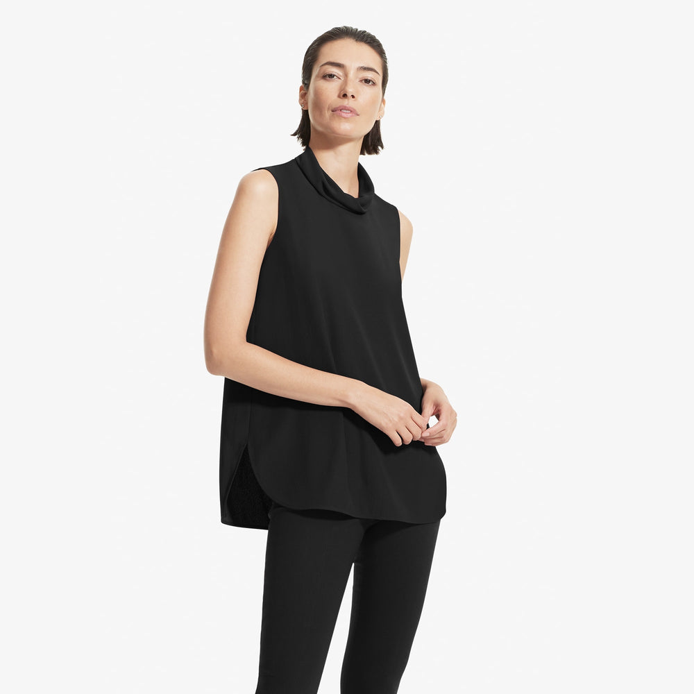 Front image of a woman standing wearing the Beverly top soft wave in Black