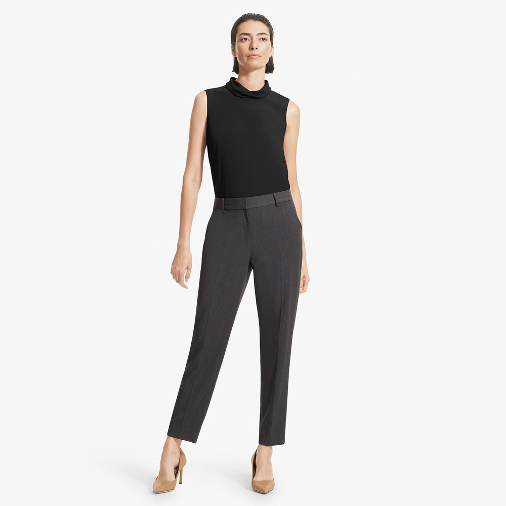 Front image of a woman standing wearing the Beverly top soft wave in Black