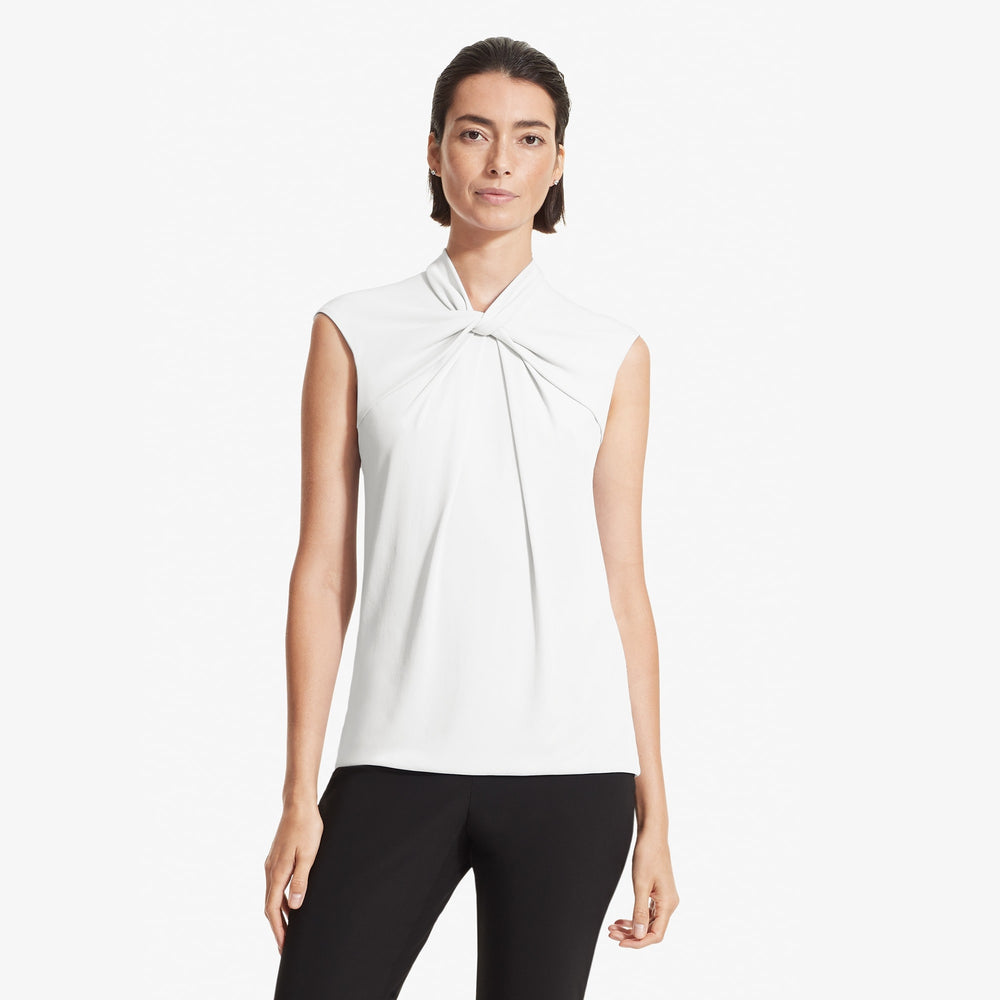 Front image of a woman standing wearing the Walters top knit crepe in Ivory