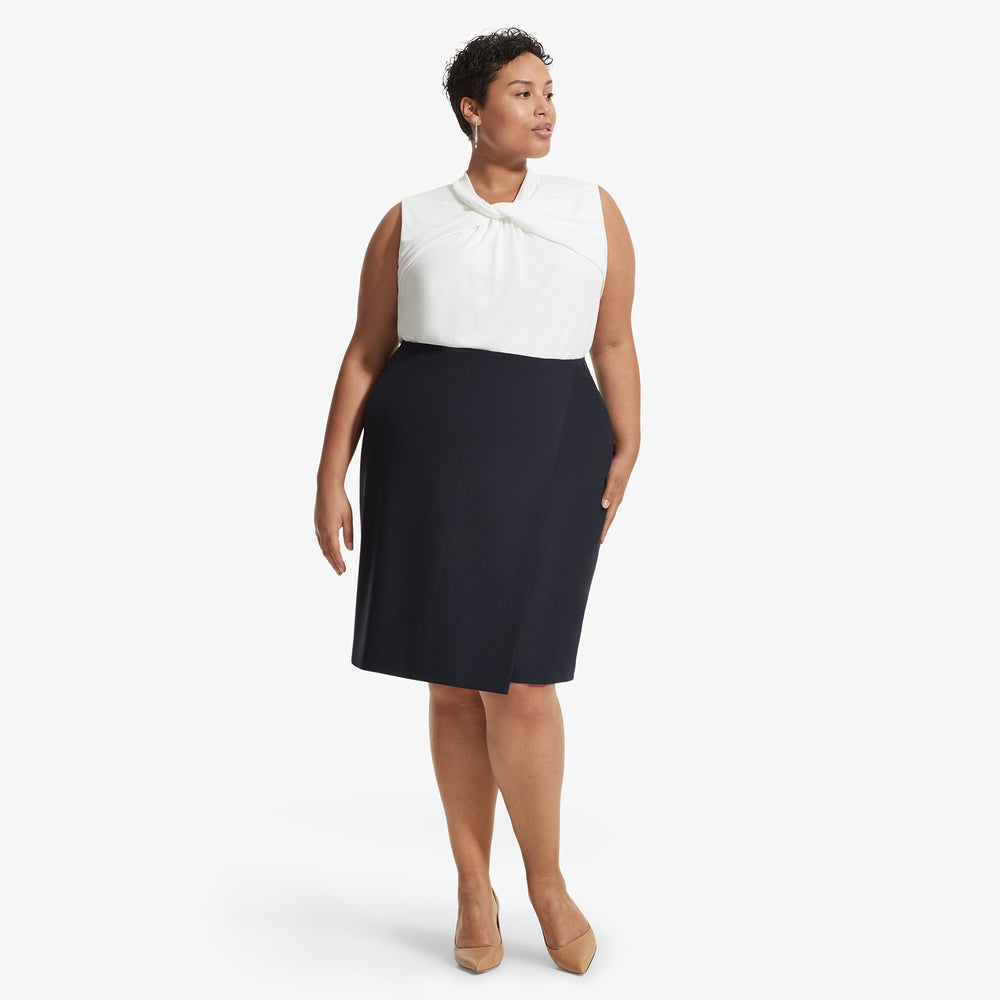 Front image of a woman standing wearing the Walters top knit crepe in Ivory