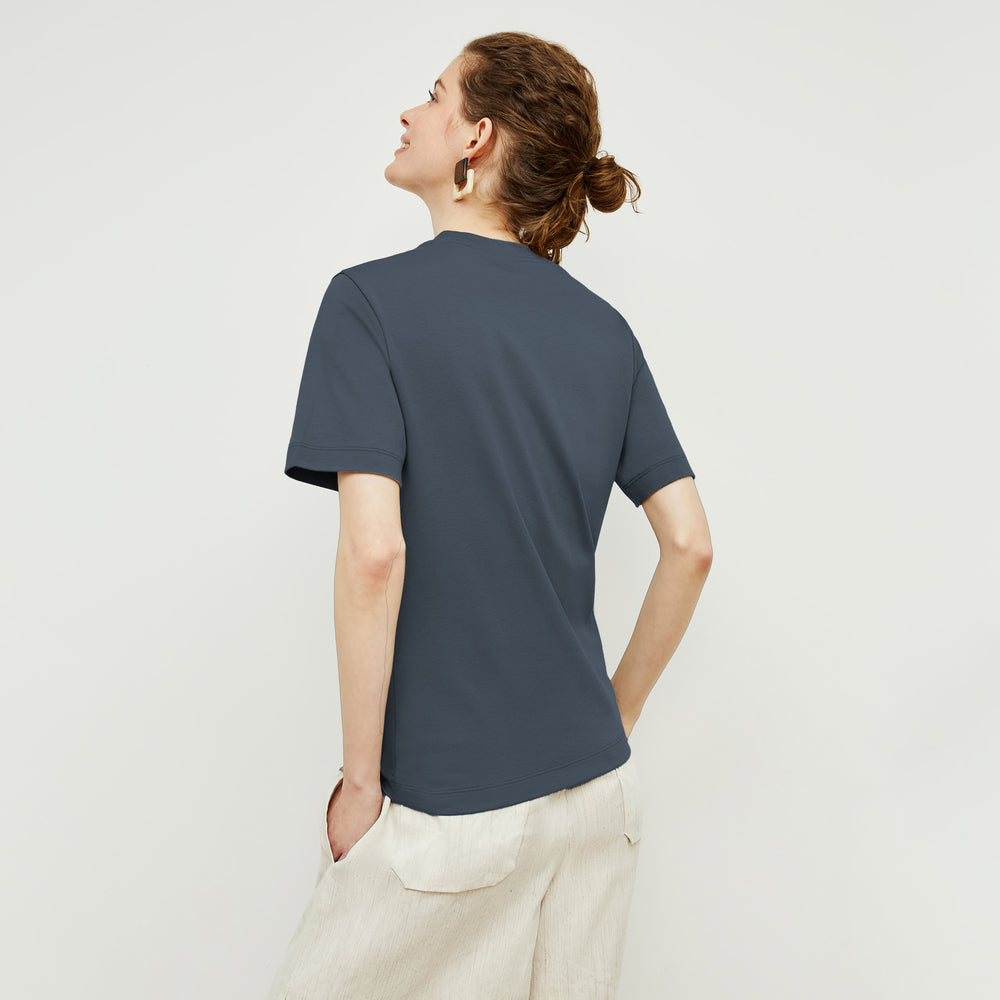 back image of a woman wearing the leslie shirt in dusty indigo