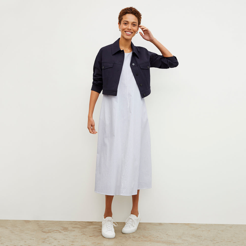 Front image of a woman wearing the Fatima Dress - Poplin Stripe in Blue / Ivory