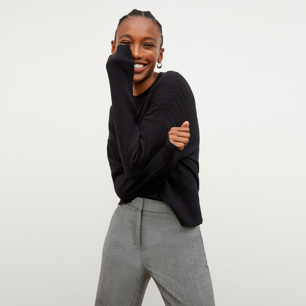 Front image of a woman wearing the Tyler Sweatshirt in Black
