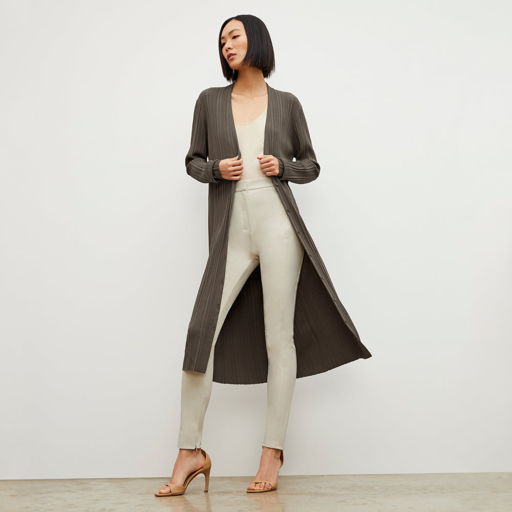 Front image of a woman standing wearing the Curie Pant—Everstretch in Bone
