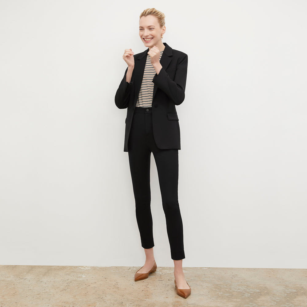 Front image of a woman wearing the Leslie T-Shirt - Thin Striped Pima Cotton in Tan / Black