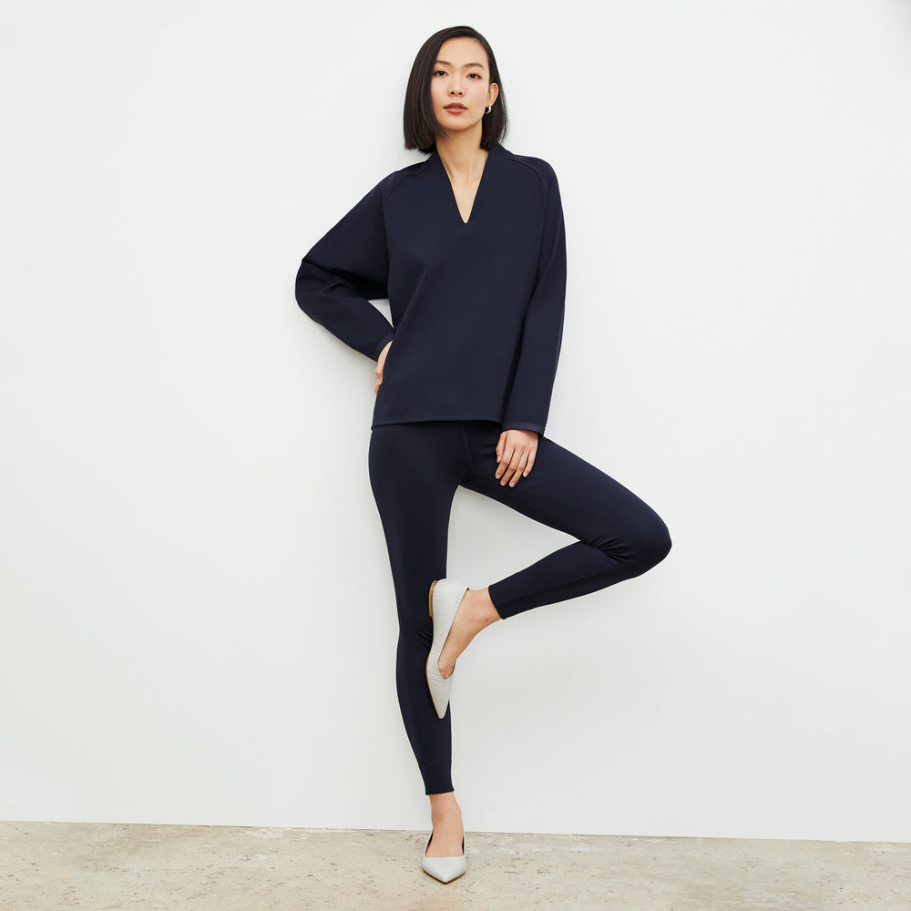 Front image of a woman wearing the Harrington Legging - Light Scuba in Space Blue