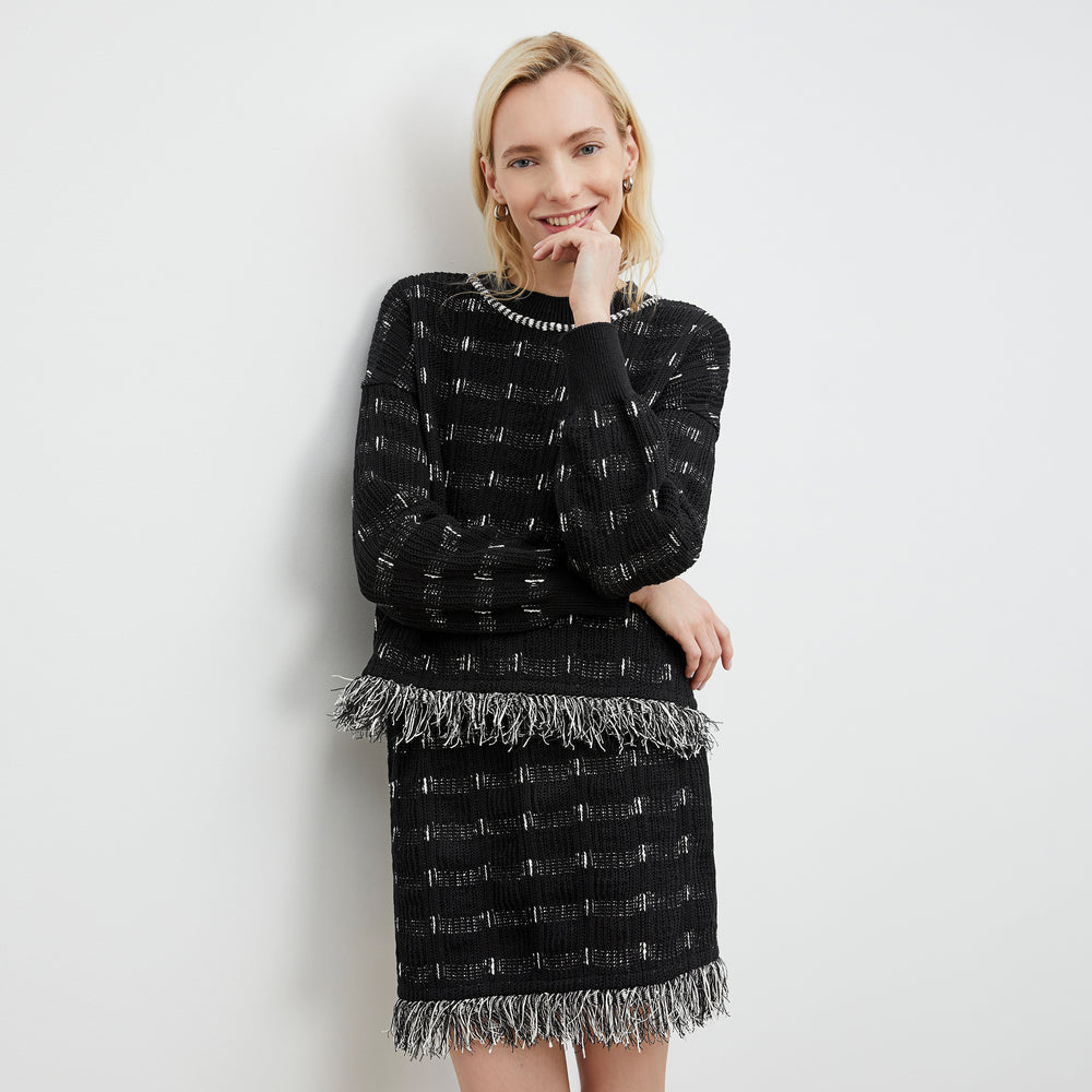 Front image of a woman wearing the Figari Pullover - Linear Interweave in Black / White