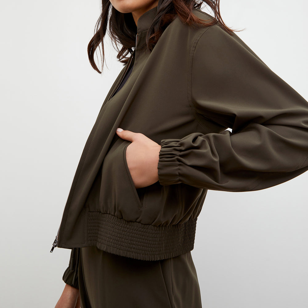 Detail image of a woman wearing the Langley Bomber - OrigamiTech in Olive