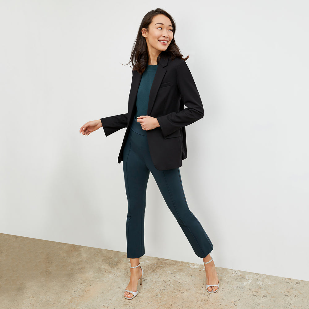 Front image of a woman wearing the Shiloh Pant in deep sea