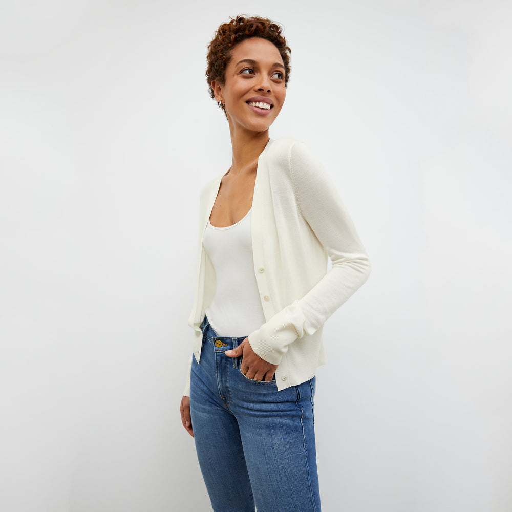 Side image of a woman wearing the Rory Cardigan - Silk Jersey in Ivory