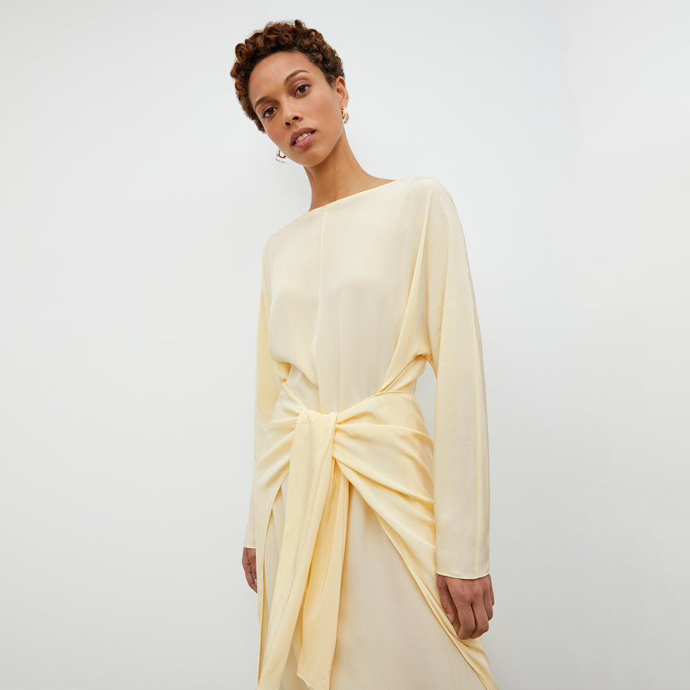Front image of a woman wearing the Rashmeen Dress - Washable Silk in Parchment