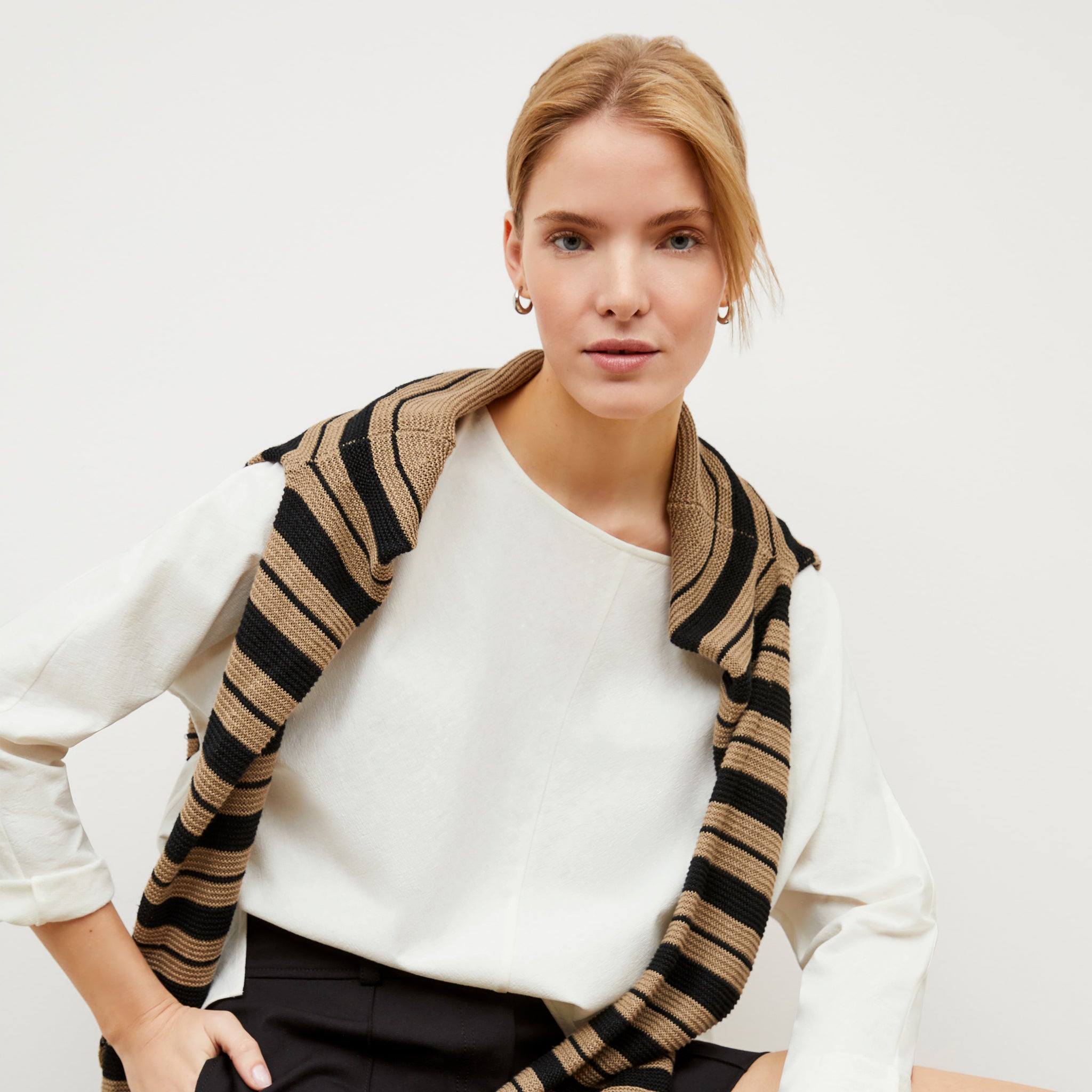 Image of a woman wearing the Wren top in Ivory