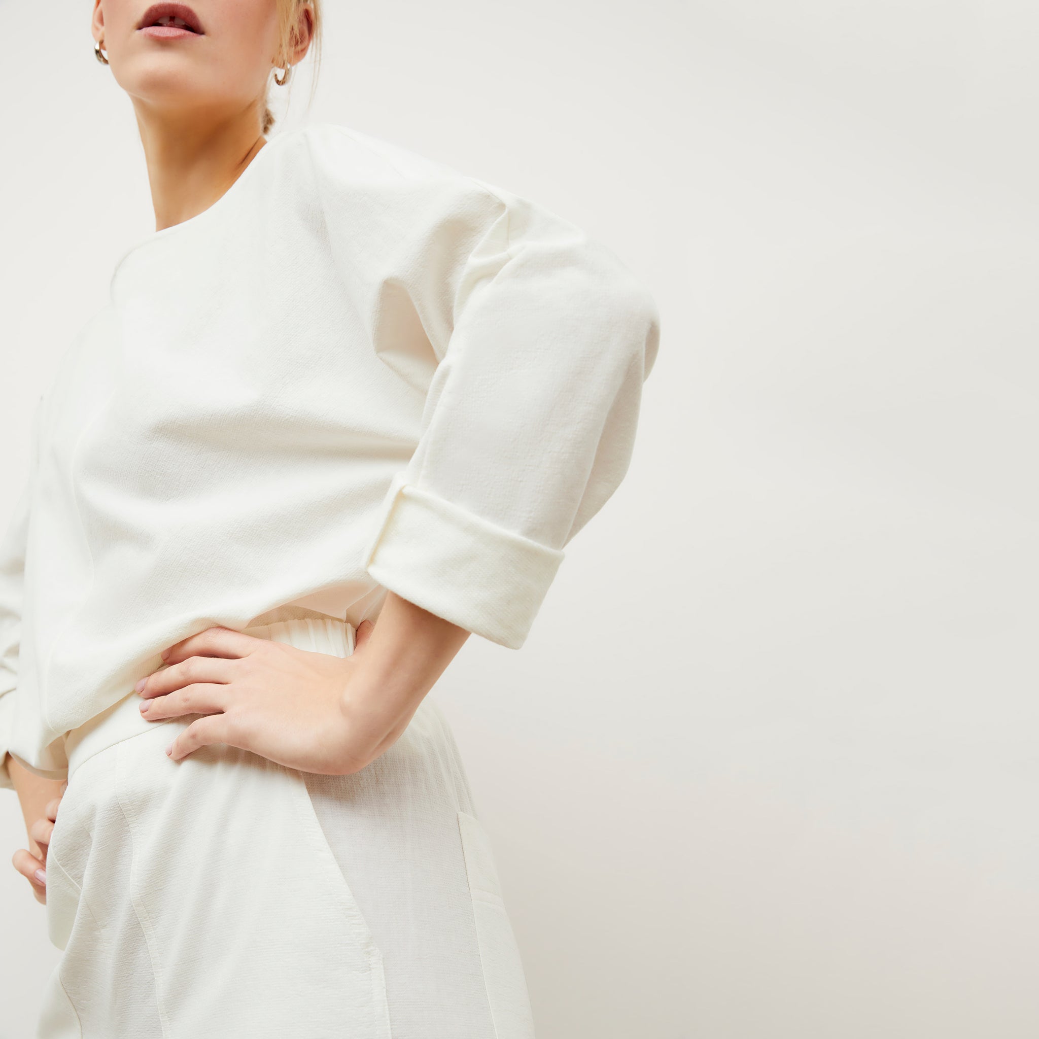 Image of a woman wearing the Wren top in Ivory