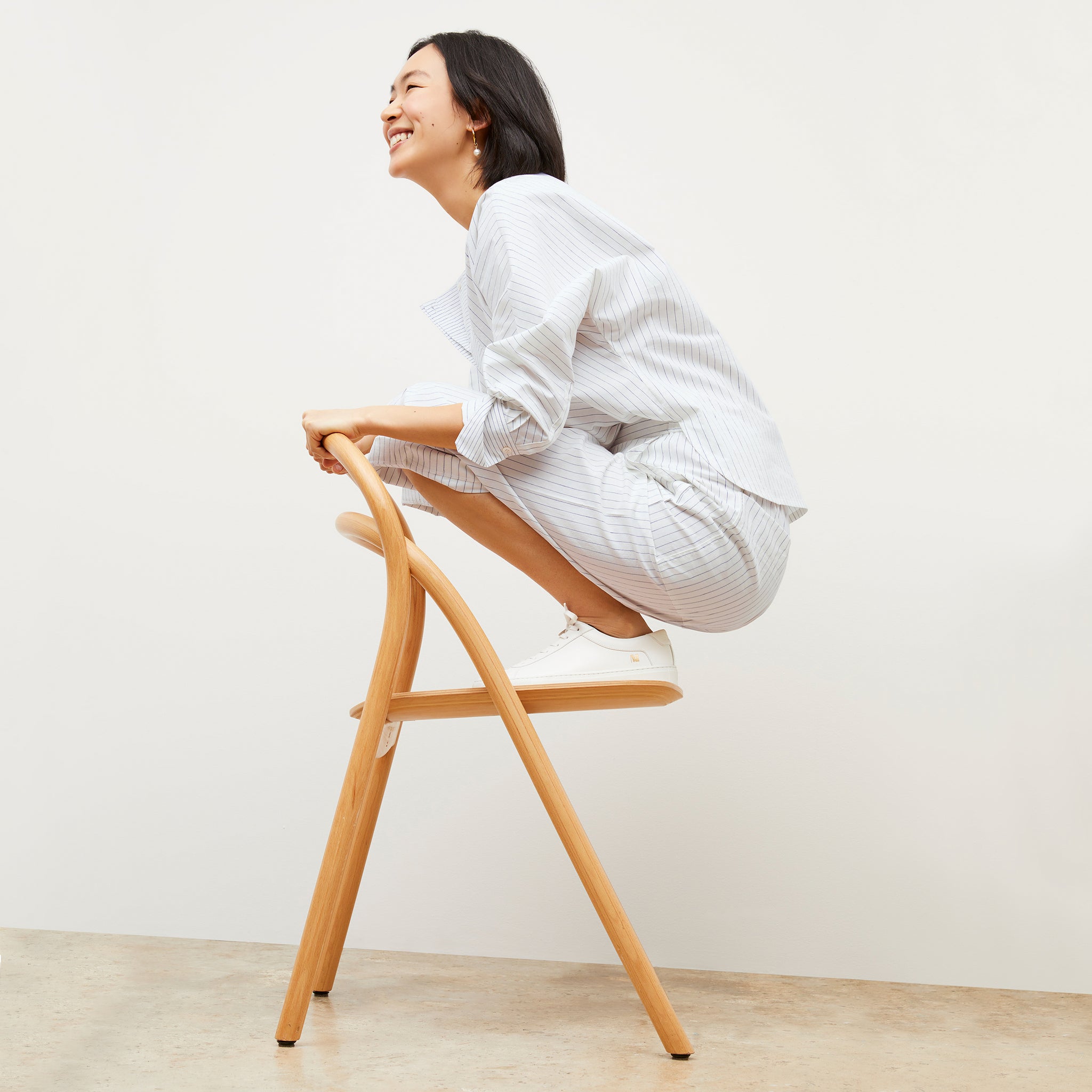 Image of a woman wearing the Madelyn Pant in Blue / Ivory