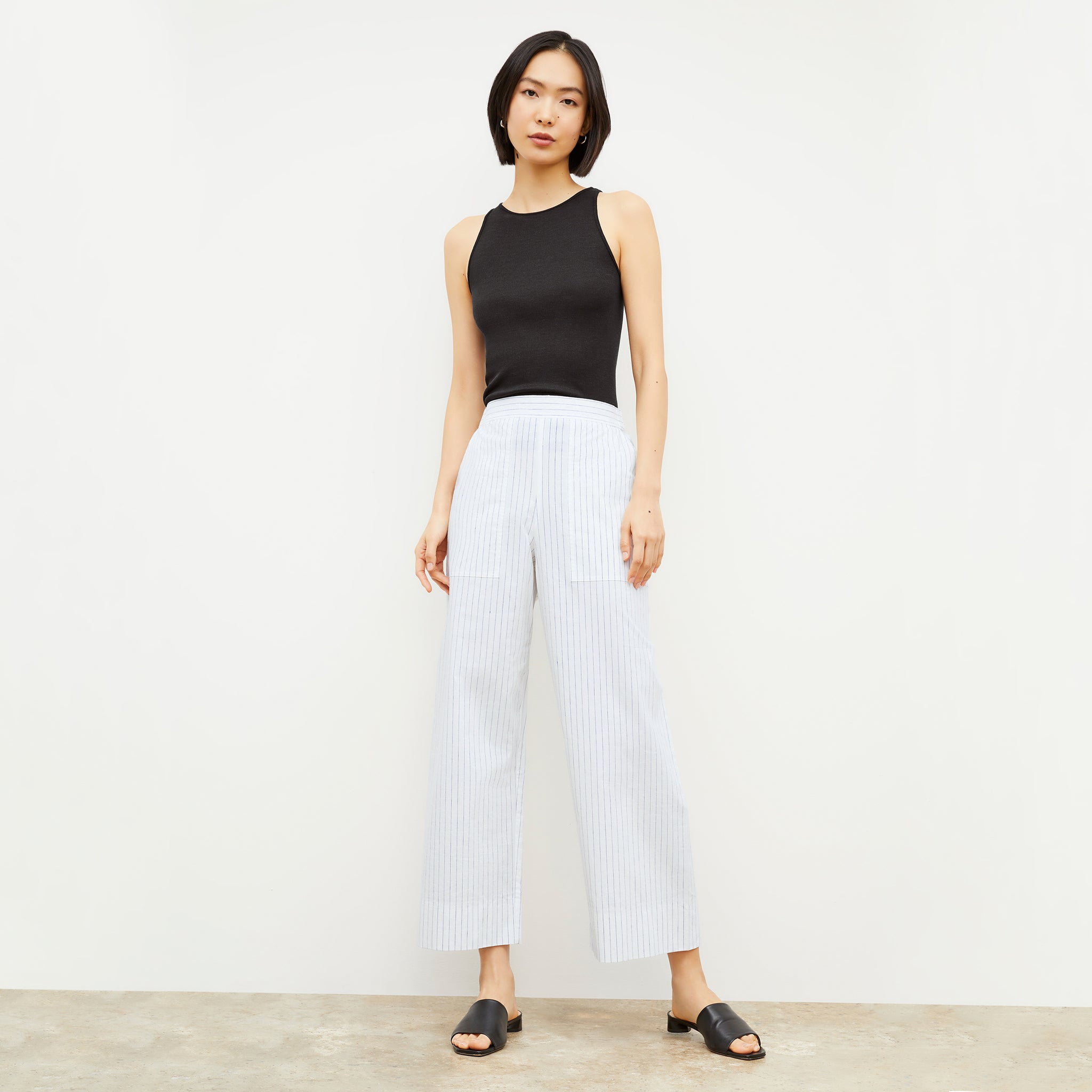 Image of a woman wearing the Madelyn Pant in Blue / Ivory 