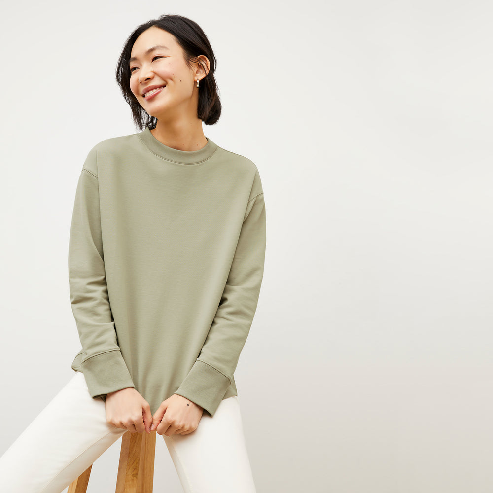 Front image of a woman wearing the Ellie Pullover - Light French Terry in Laurel Green